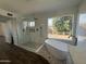 Spa-like bathroom with soaking tub, walk-in shower, and marble tile at 16442 N 59Th Pl, Scottsdale, AZ 85254