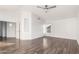 Bright bedroom with wood-look floors and ceiling fan at 16442 N 59Th Pl, Scottsdale, AZ 85254