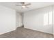 Bright bedroom with ceiling fan and plush carpeting at 16442 N 59Th Pl, Scottsdale, AZ 85254