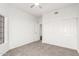 Well-lit bedroom with mirrored closet doors and carpeting at 16442 N 59Th Pl, Scottsdale, AZ 85254