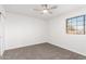 Well-lit bedroom with carpet floors and window views at 16442 N 59Th Pl, Scottsdale, AZ 85254