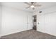 Cozy bedroom featuring carpet floors and ceiling fan at 16442 N 59Th Pl, Scottsdale, AZ 85254