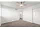 Bright bedroom with carpet flooring and ceiling fan at 16442 N 59Th Pl, Scottsdale, AZ 85254