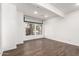 Bright bonus room with wood-look tile flooring and projector at 16442 N 59Th Pl, Scottsdale, AZ 85254