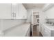 Laundry room with white cabinets and quartz countertops at 16442 N 59Th Pl, Scottsdale, AZ 85254