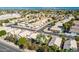 An aerial view shows a desert neighborhood with well-manicured landscaping at 1778 S Saddle St, Gilbert, AZ 85233
