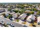 An aerial view shows homes with desert landscaping in a neat, suburban community at 1778 S Saddle St, Gilbert, AZ 85233