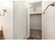 Bathroom area showing a glass enclosed shower, a closet and wood look flooring at 1778 S Saddle St, Gilbert, AZ 85233