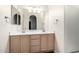 Bathroom features a double sink vanity with a large mirror and plenty of light at 1778 S Saddle St, Gilbert, AZ 85233