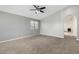 Comfortable bedroom with neutral paint, plush carpet, and a ceiling fan at 1778 S Saddle St, Gilbert, AZ 85233