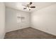 Neutral bedroom with a ceiling fan, carpet and a window with blinds at 1778 S Saddle St, Gilbert, AZ 85233