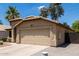 Inviting curb appeal featuring an attached two-car garage and desert landscaping at 1778 S Saddle St, Gilbert, AZ 85233
