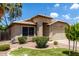 Well-maintained property featuring neat landscaping, desert accents, and an attached two-car garage at 1778 S Saddle St, Gilbert, AZ 85233
