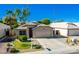 Lovely desert home with front lawn and mature landscaping at 1778 S Saddle St, Gilbert, AZ 85233