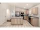 Eat-in kitchen boasts stainless steel appliances, a center island, and abundant cabinet space at 1778 S Saddle St, Gilbert, AZ 85233