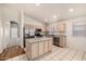 Eat-in kitchen features stainless steel appliances, island, tile flooring, and plenty of natural light at 1778 S Saddle St, Gilbert, AZ 85233