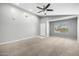Bright living room with neutral paint, plush carpet, and great natural light from the window at 1778 S Saddle St, Gilbert, AZ 85233
