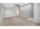 Spacious living room featuring a ceiling fan, neutral paint, and archway access to other spaces at 1778 S Saddle St, Gilbert, AZ 85233