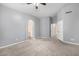 Spacious main bedroom with neutral walls and carpeting, archway to ensuite bath, and walk-in closet at 1778 S Saddle St, Gilbert, AZ 85233