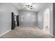 Spacious primary bedroom with vaulted ceiling, dual windows, slider to balcony, and neutral carpet at 1778 S Saddle St, Gilbert, AZ 85233