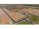 Aerial view of new homes and empty lots in a developing neighborhood at 35907 W San Clemente Ave, Maricopa, AZ 85138