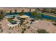 Community features playground, basketball court, and lake at 35907 W San Clemente Ave, Maricopa, AZ 85138