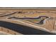 Aerial view of a community pond and landscaping under construction at 35907 W San Clemente Ave, Maricopa, AZ 85138