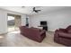 Living room with tile floors, a ceiling fan, and sliding glass doors at 35907 W San Clemente Ave, Maricopa, AZ 85138