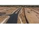 Aerial view of new roads under construction in a community at 35907 W San Clemente Ave, Maricopa, AZ 85138