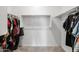 Spacious walk-in closet with ample shelving and hanging space at 35907 W San Clemente Ave, Maricopa, AZ 85138