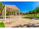 Covered picnic area with bike rack and playground in background at 3901 E Sagebrush St, Gilbert, AZ 85296