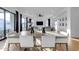 Modern dining room with a large concrete table and white chairs at 3901 E Sagebrush St, Gilbert, AZ 85296