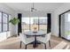 Round dining table with white chairs and view of backyard at 3901 E Sagebrush St, Gilbert, AZ 85296