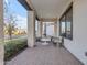 Inviting front porch with brick flooring, modern furniture, and a view of the street at 3901 E Sagebrush St, Gilbert, AZ 85296