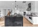 Modern kitchen with dark countertops, white cabinets, and a range hood at 3901 E Sagebrush St, Gilbert, AZ 85296