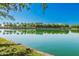 Scenic lake view with palm trees and reflection of clubhouse at 3901 E Sagebrush St, Gilbert, AZ 85296