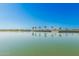 Calm lake with palm trees and houses in background at 3901 E Sagebrush St, Gilbert, AZ 85296