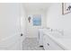 Clean laundry room with white cabinets and herringbone floor at 3901 E Sagebrush St, Gilbert, AZ 85296