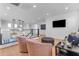 Bright sitting area with two armchairs, ottoman, and hardwood floors at 3901 E Sagebrush St, Gilbert, AZ 85296