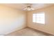 Simple bedroom with window and ceiling fan at 6908 E Windsor Ave, Scottsdale, AZ 85257