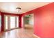 Bright entryway with red walls, hardwood floors, and access to living areas at 6908 E Windsor Ave, Scottsdale, AZ 85257