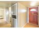 Hallway with built-in storage and access to bathroom at 6908 E Windsor Ave, Scottsdale, AZ 85257