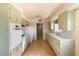 Retro kitchen with light green cabinets and appliances at 6908 E Windsor Ave, Scottsdale, AZ 85257