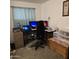 Home office with multiple monitors, laptop, and printer at 7300 N 51St Ave # E78, Glendale, AZ 85301