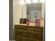 Wood vanity with mirror and drawers, perfect for makeup and toiletries at 7300 N 51St Ave # E78, Glendale, AZ 85301