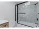 This primary bathroom features a large, tiled shower with a black framed door and shower hardware at 7955 E Chaparral Rd # 103, Scottsdale, AZ 85250