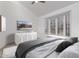 Serene bedroom featuring plantation shutters, soft carpeting, and a contemporary design at 7955 E Chaparral Rd # 103, Scottsdale, AZ 85250
