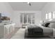 Sunlit bedroom showcases a bay window, bench seating, and modern decor, creating a restful retreat at 7955 E Chaparral Rd # 103, Scottsdale, AZ 85250