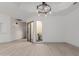 Open dining area featuring wood-look tile floors and a modern chandelier at 7955 E Chaparral Rd # 103, Scottsdale, AZ 85250