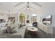 Bright living room boasts soaring ceilings, fireplace, and large windows that flood the space with natural light at 7955 E Chaparral Rd # 103, Scottsdale, AZ 85250